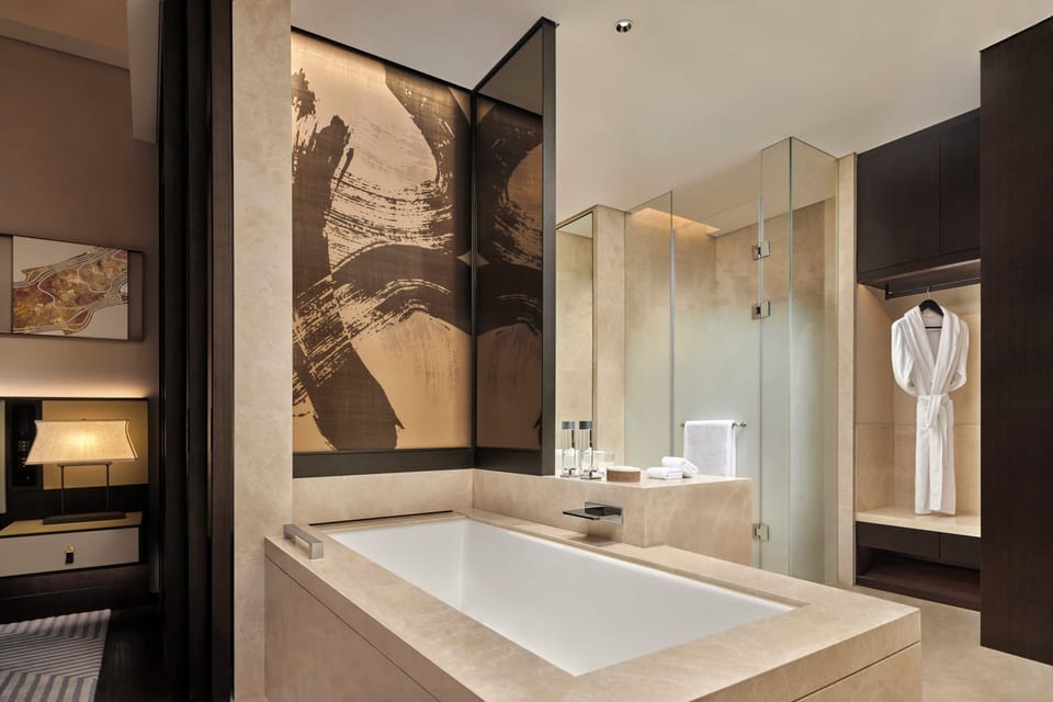 Separate tub and shower, free toiletries, hair dryer, bathrobes