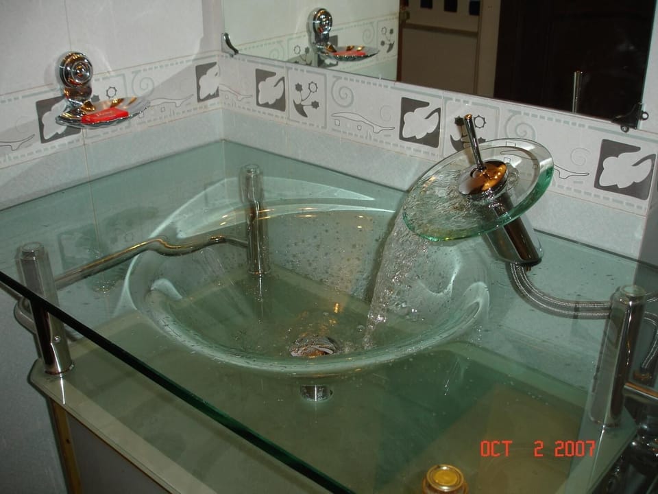 Shower, rainfall showerhead, designer toiletries, hair dryer