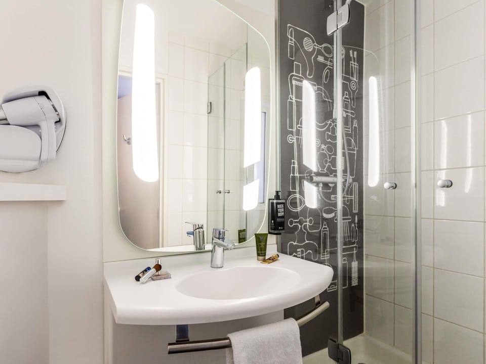 Shower, eco-friendly toiletries, hair dryer, towels