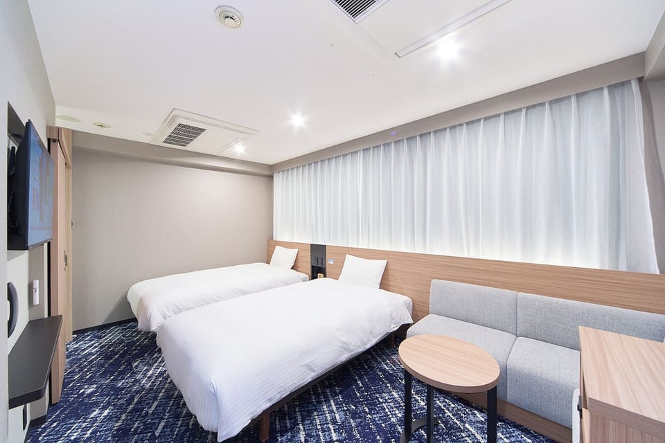 Twin Room, Non Smoking | Down comforters, free wired internet, bed sheets
