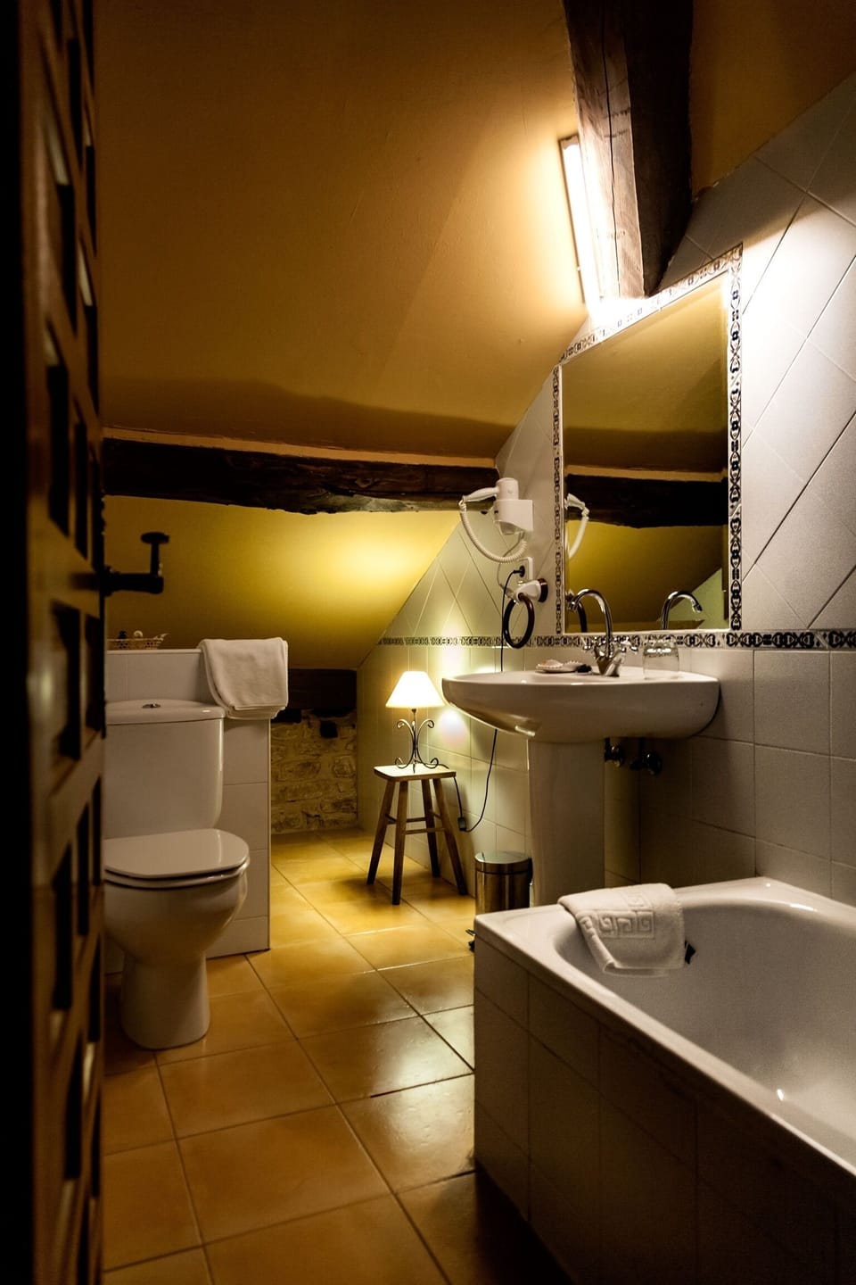Bathtub, hair dryer, towels, soap