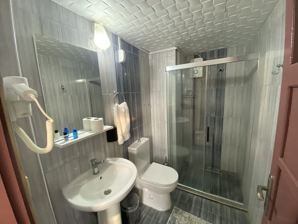 Apartment, 2 Bedrooms | Bathroom | Shower, hair dryer, bathrobes, slippers