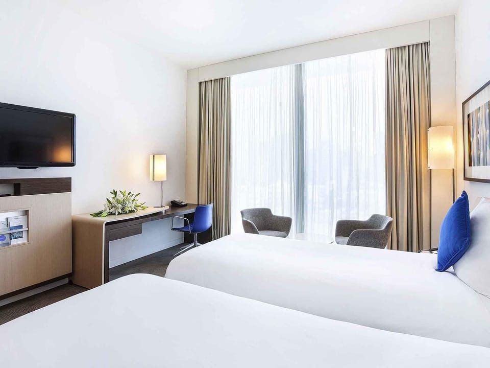 Superior Twin Room | Minibar, in-room safe, individually decorated, desk