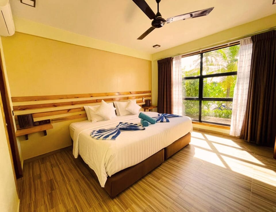 Deluxe Double Room, Beach View | Pillowtop beds, free minibar items, in-room safe, individually furnished