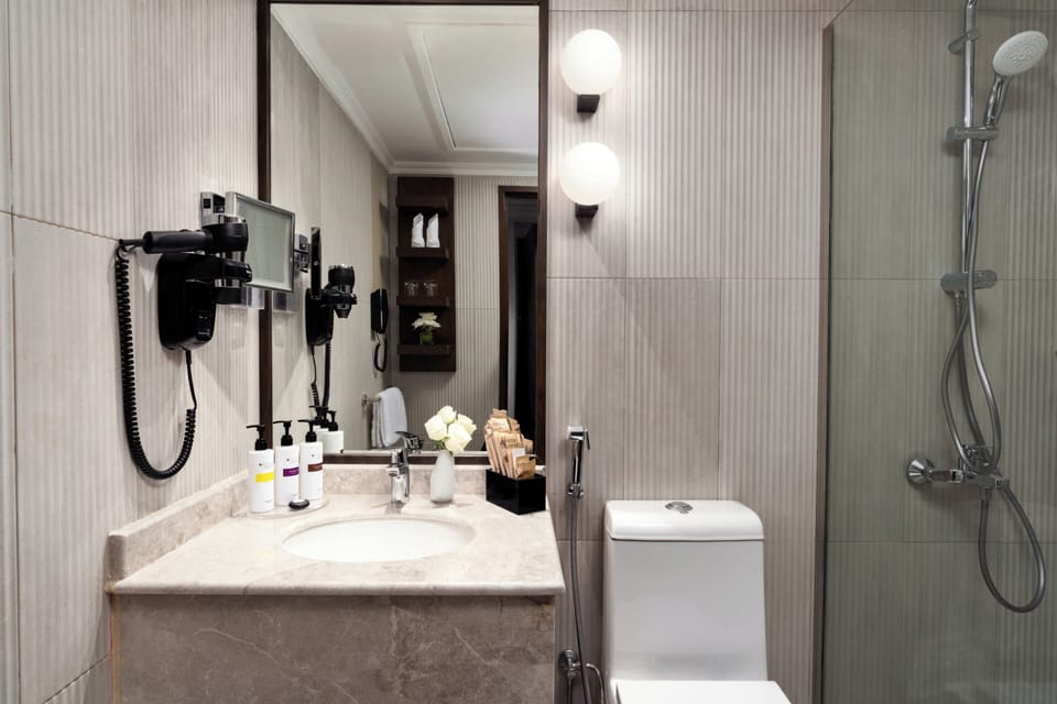 Eco-friendly toiletries, hair dryer, bathrobes, towels