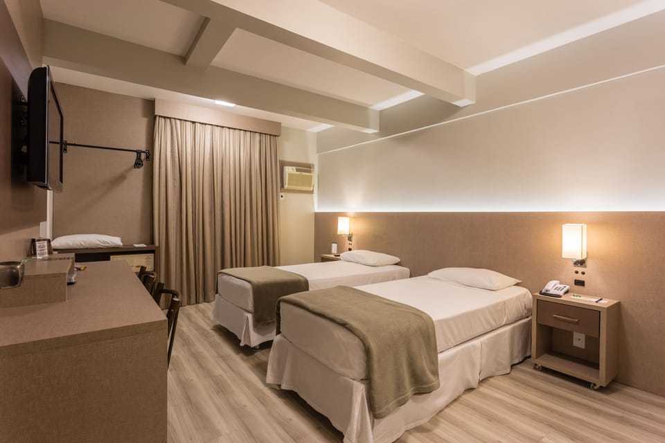Standard Room, 2 Twin Beds | Minibar, in-room safe, desk, laptop workspace