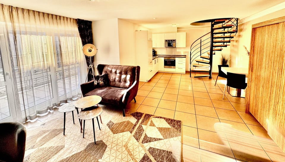 Suite Apartment | Living area | 55-inch flat-screen TV with digital channels, TV
