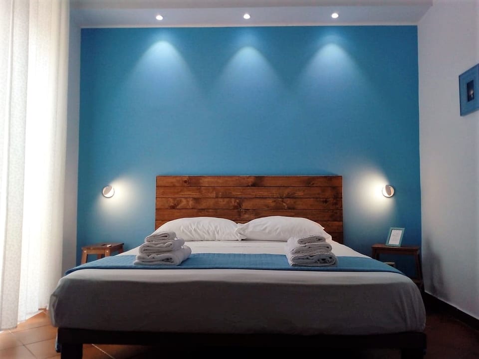 Standard Triple Room, Balcony | Down comforters, memory foam beds, individually decorated