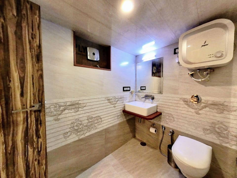 Family Room, 2 Double Beds | Bathroom | Shower, slippers, towels