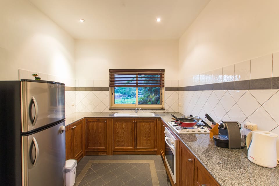 Villa, 3 Bedrooms, Non Smoking, Kitchen | Private kitchen | Full-size fridge, microwave, oven, stovetop