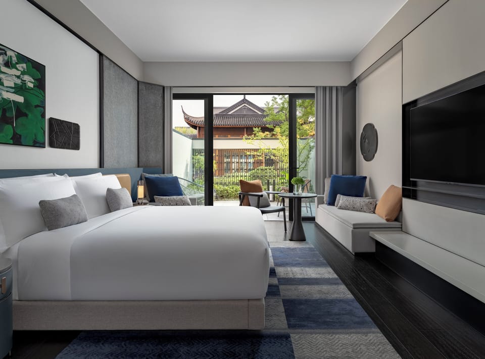 1 King Essential Outdoor Living Area | Down comforters, minibar, in-room safe, laptop workspace