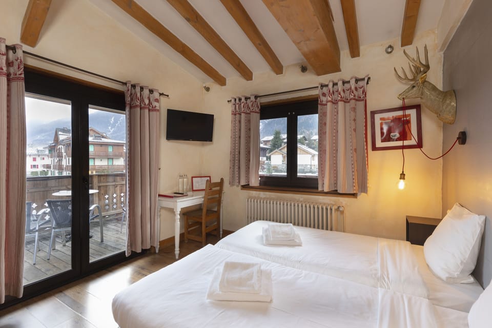 Quadruple Room, Terrace Mont-Blanc View | In-room safe, desk, soundproofing, iron/ironing board