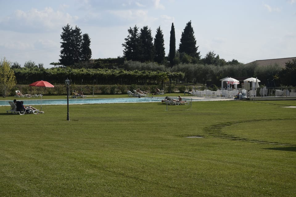 Seasonal outdoor pool, open 8:00 AM to 8:00 PM, pool umbrellas