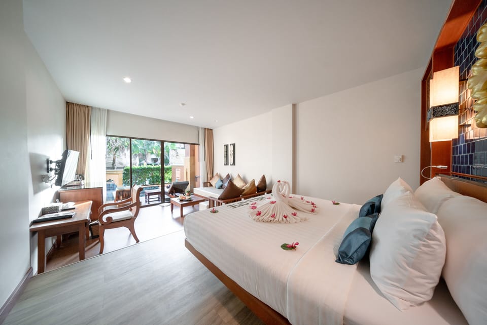 Deluxe Room, Pool Access | Pillowtop beds, minibar, in-room safe, desk