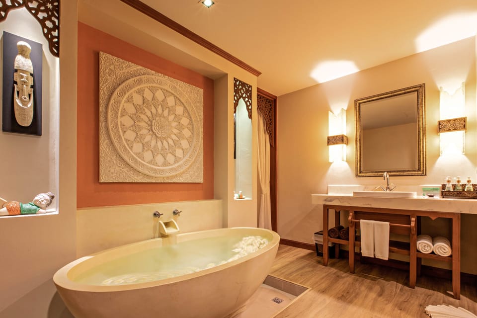 Deluxe Room, Pool Access | Bathroom | Hair dryer, slippers, towels, soap