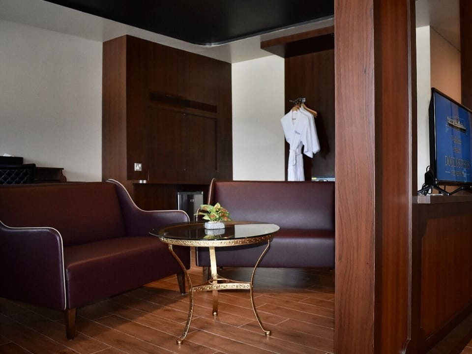 Suite with Balcony | Living area | 32-inch LED TV with cable channels, TV, toys