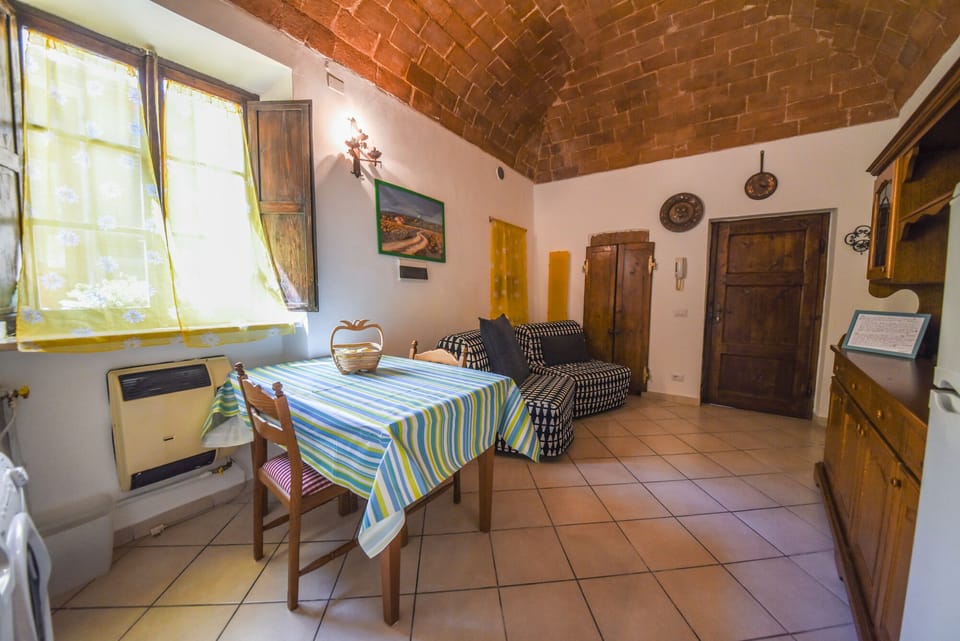 Apartment, 1 Bedroom (In Famiglia) | Living area | Flat-screen TV