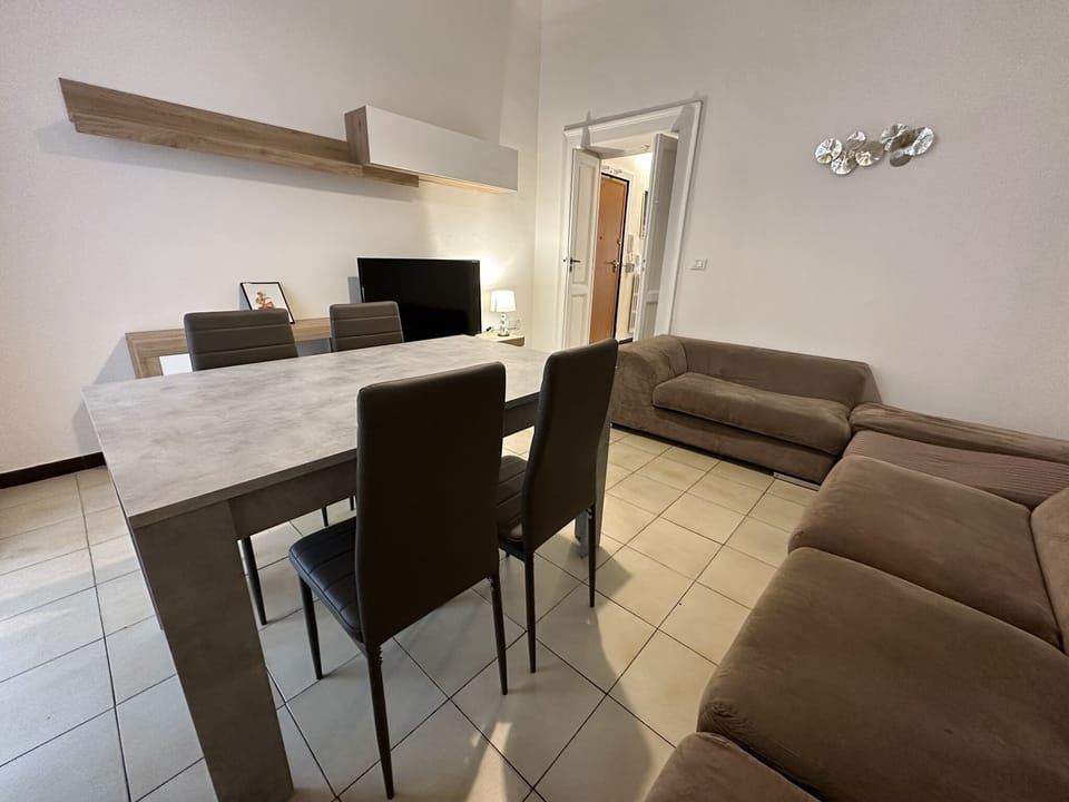 Deluxe Apartment | Living area | 50-inch flat-screen TV with digital channels, TV