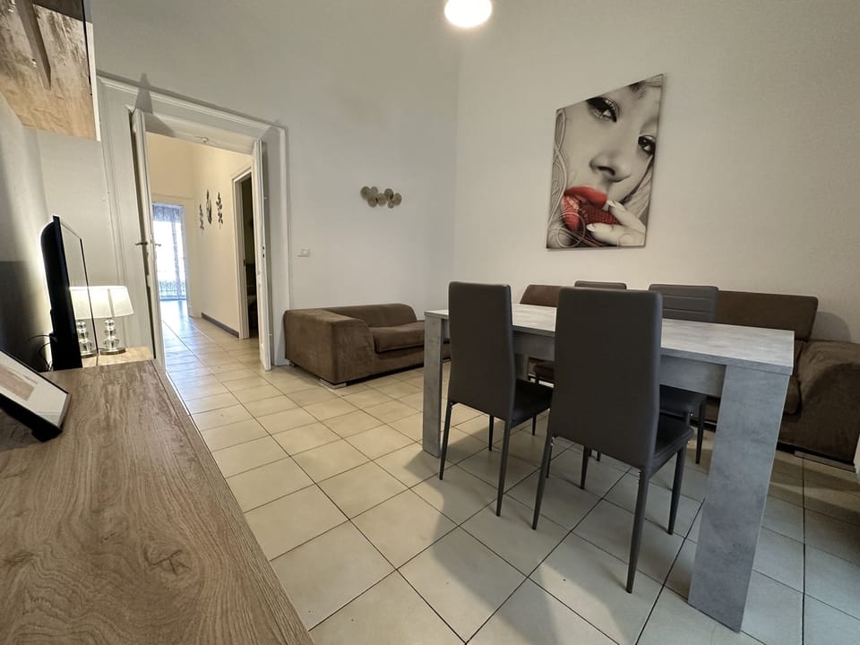 Deluxe Apartment | Living area | 50-inch flat-screen TV with digital channels, TV
