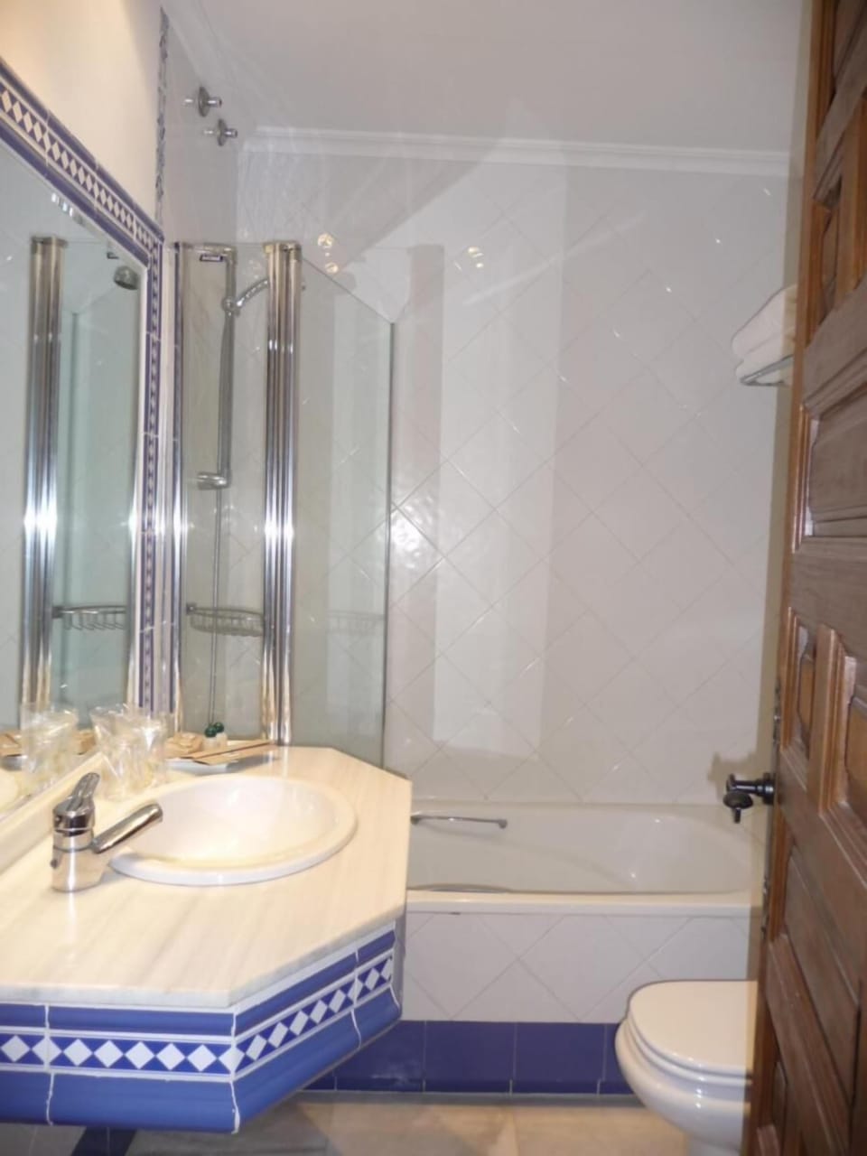 Bathtub, hair dryer, bathrobes, towels
