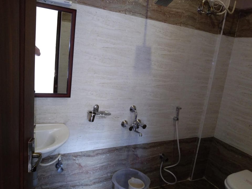 Shower, rainfall showerhead, towels, soap