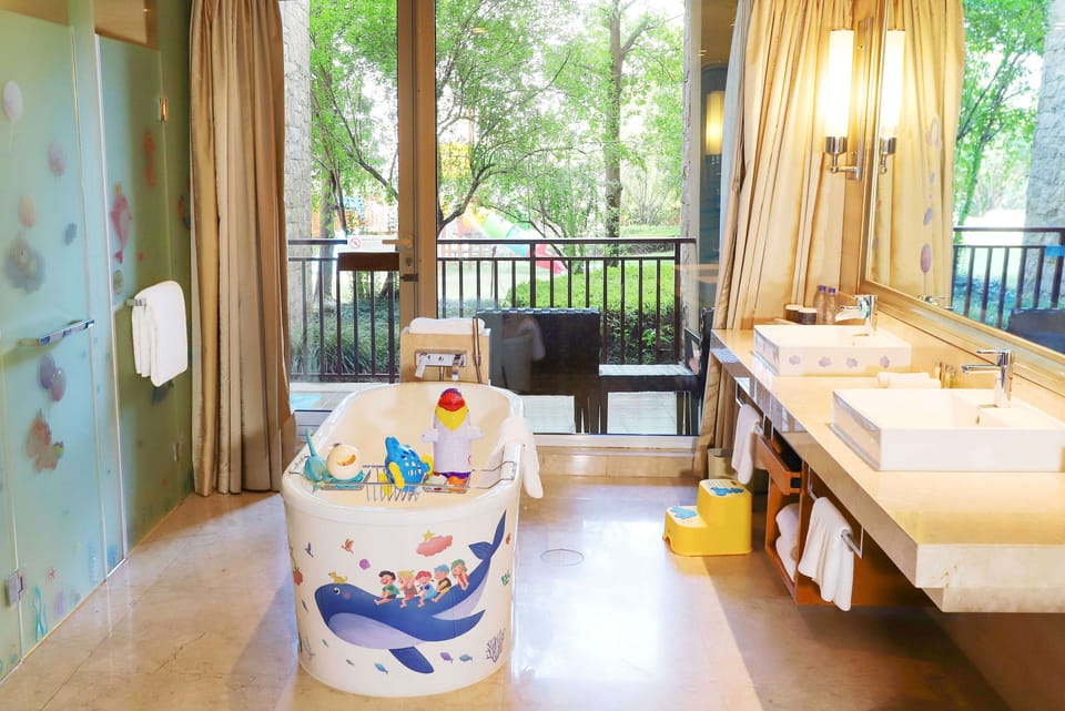 Family Room, 1 King Bed | Bathroom | Separate tub and shower, rainfall showerhead, designer toiletries