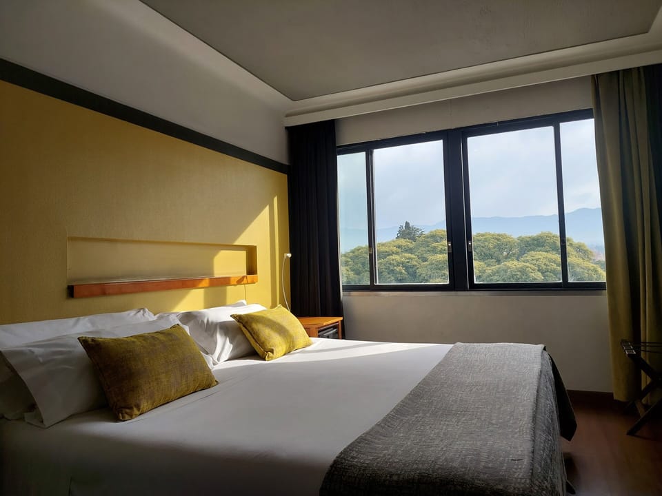 Superior Room | Minibar, in-room safe, desk, blackout drapes