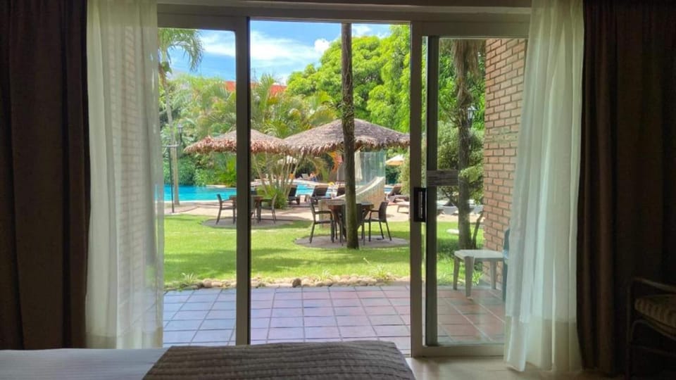 Deluxe Room, 2 Queen Beds, Poolside | 1 bedroom, minibar, in-room safe, desk