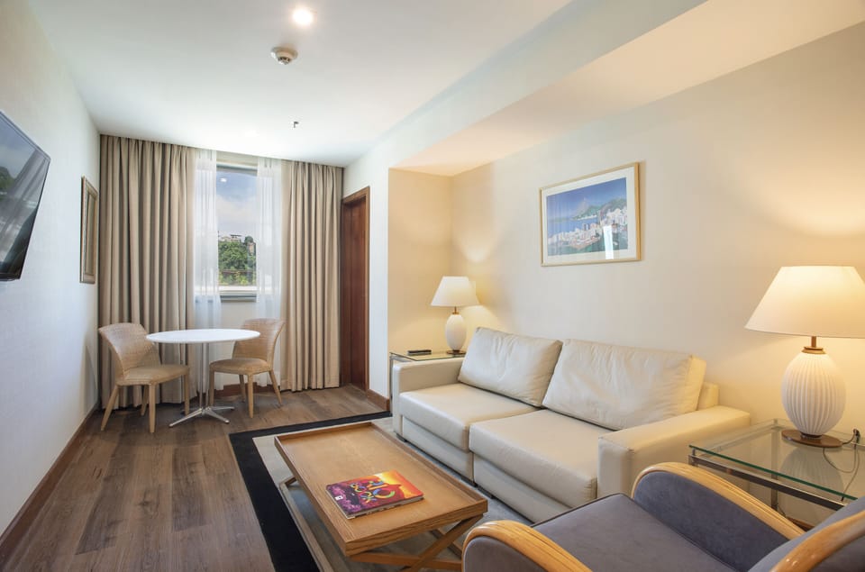 Junior Suite with City View | Minibar, in-room safe, desk, laptop workspace