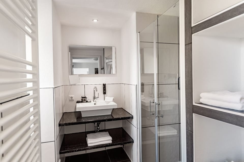 Comfort Apartment | Bathroom | Rainfall showerhead, hair dryer, bathrobes, slippers