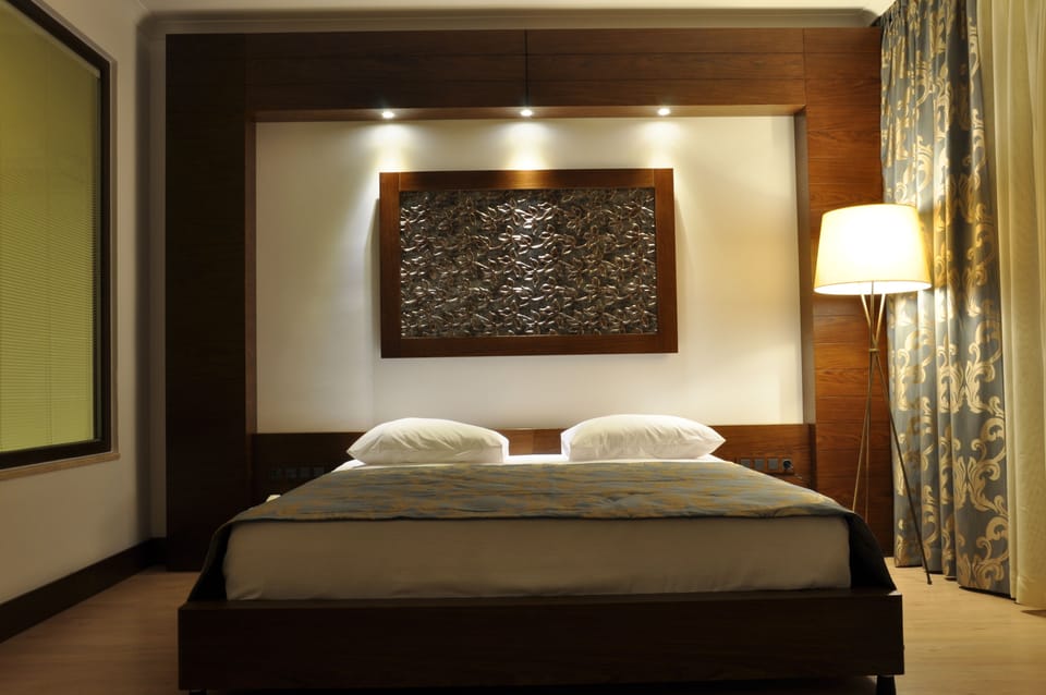 Suite, 1 Bedroom, Sea View | Minibar, in-room safe, soundproofing, iron/ironing board