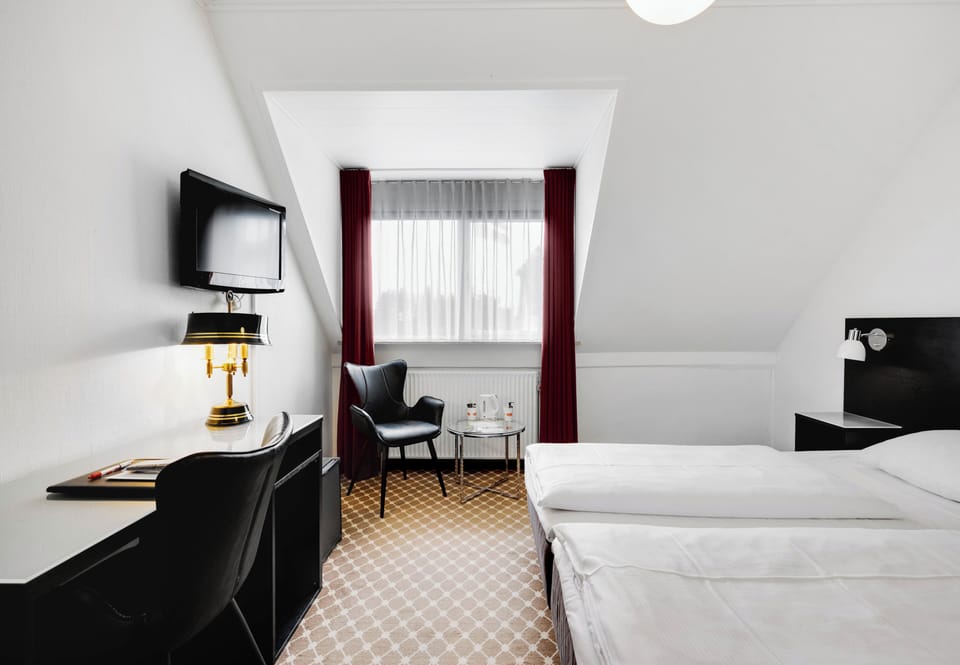 Standard Double Room | Pillowtop beds, desk, blackout drapes, iron/ironing board