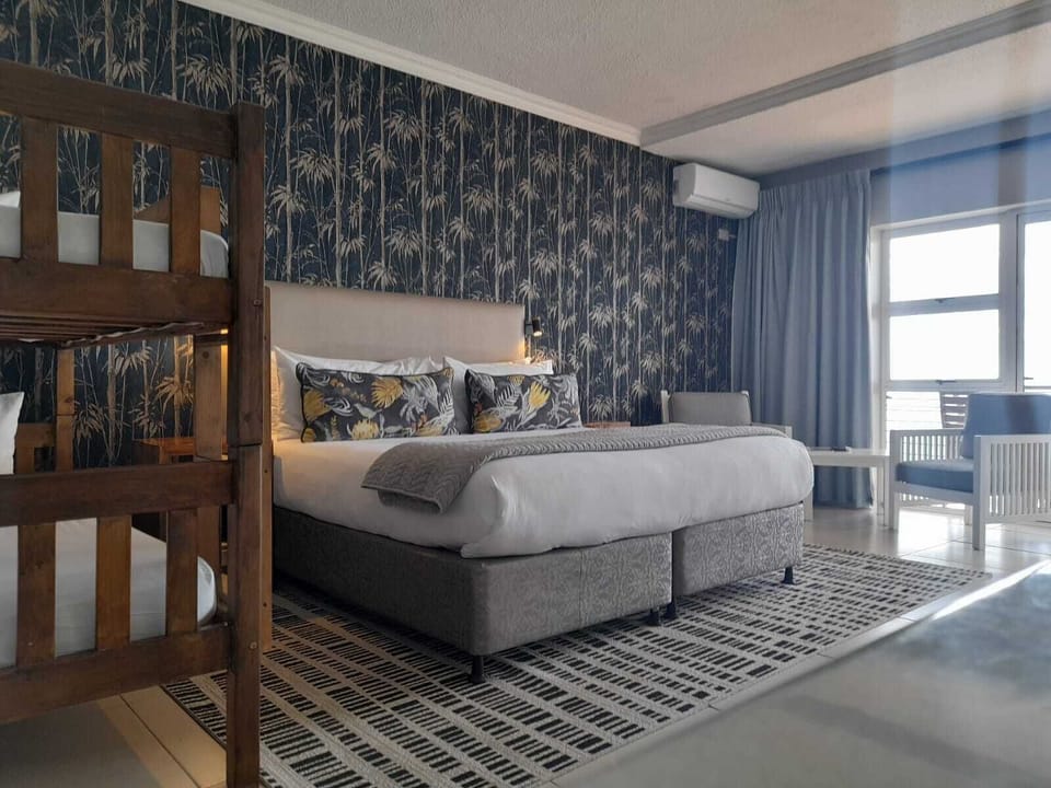 Standard Quadruple Room | In-room safe, desk, blackout drapes, iron/ironing board