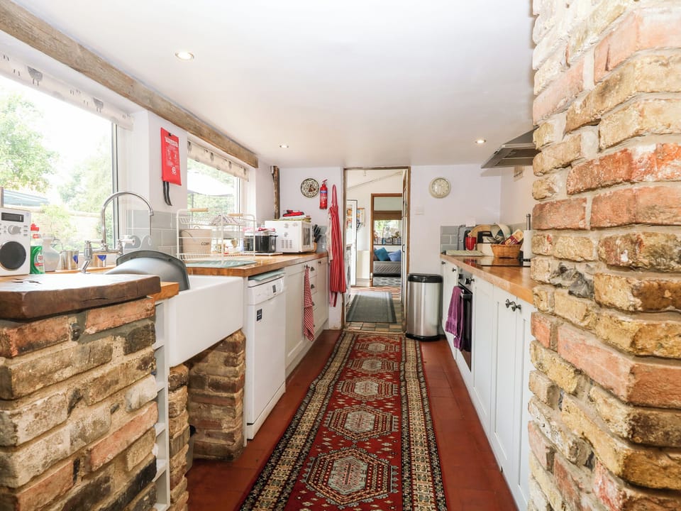 Cottage | Private kitchen | Fridge, dishwasher, highchair, cookware/dishes/utensils