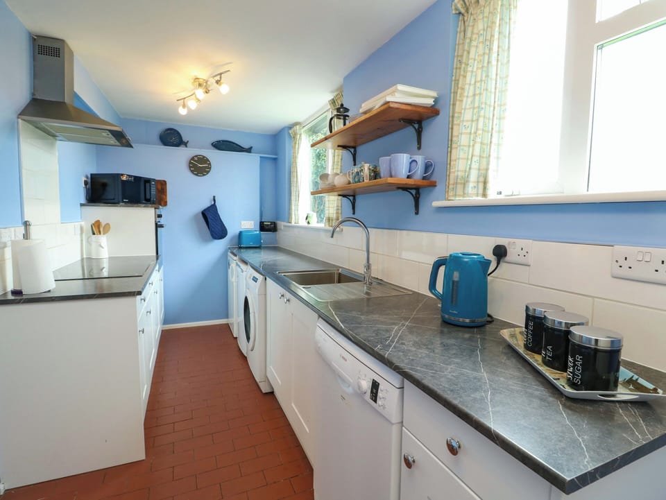 Fridge, dishwasher, highchair, cookware/dishes/utensils