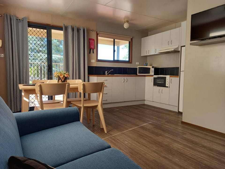 Deluxe Cabin | Living area | Flat-screen TV