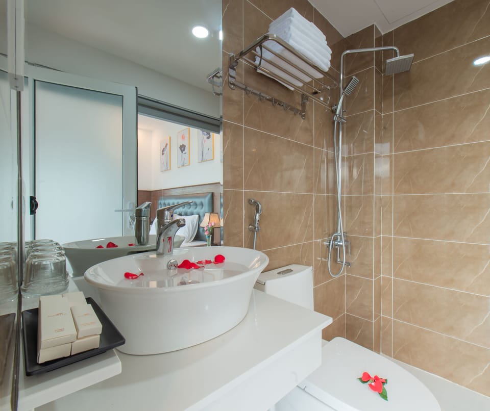 Shower, rainfall showerhead, designer toiletries, hair dryer