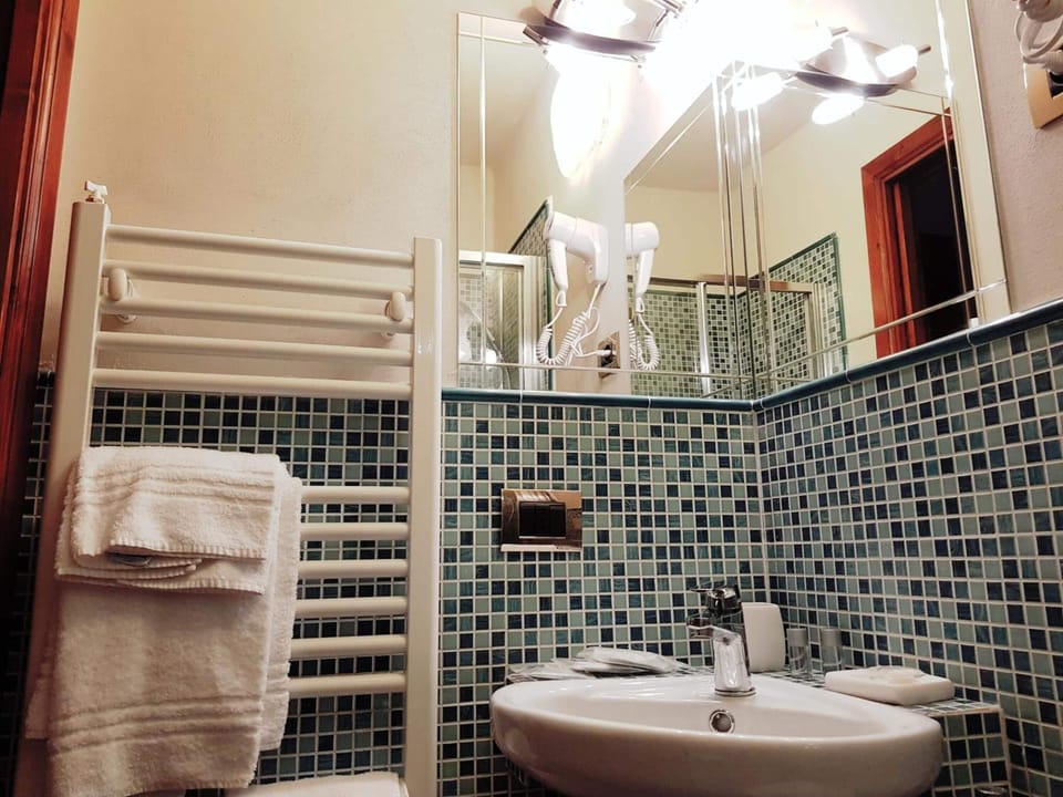 Shower, free toiletries, hair dryer, slippers