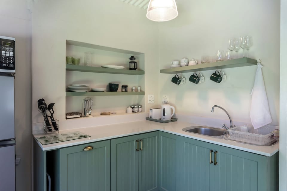 Self-Catering Suite | Private kitchen | Microwave, coffee/tea maker, electric kettle