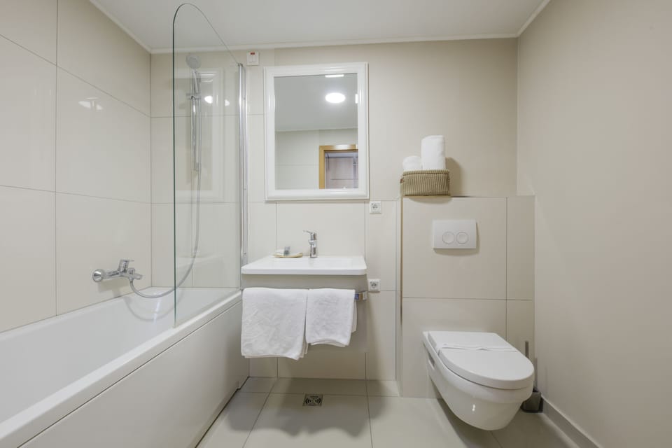 Bathtub, hair dryer, towels