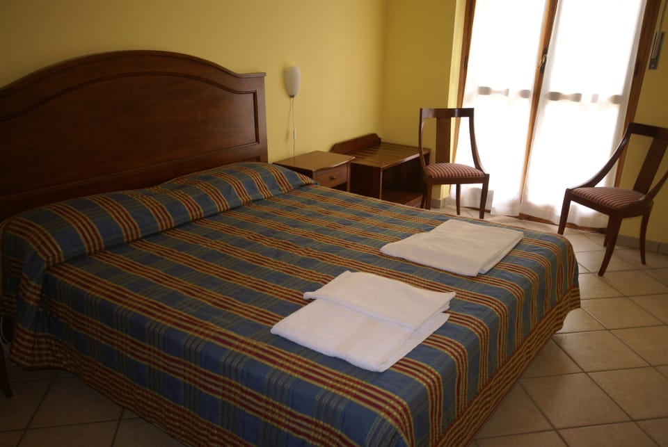 Premium bedding, individually furnished, desk, laptop workspace
