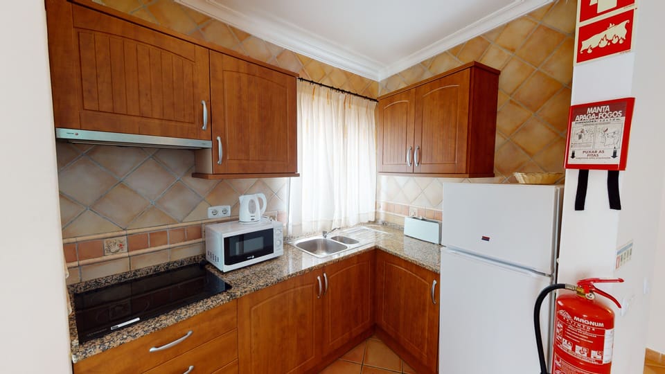 Apartment, 2 Bedrooms | Private kitchen | Fridge, microwave, stovetop, coffee/tea maker