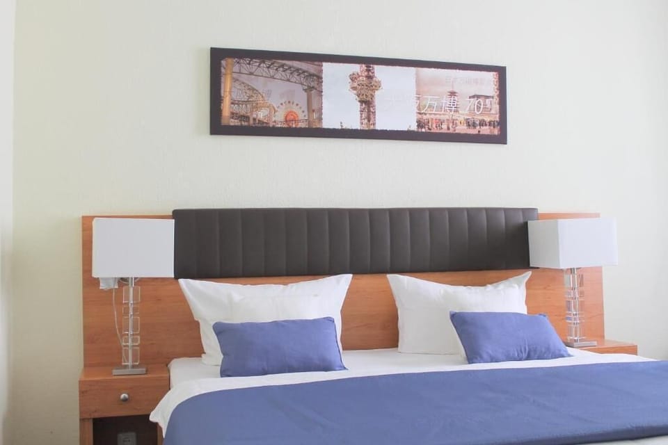 Business Twin Room | Minibar, desk, laptop workspace, blackout drapes