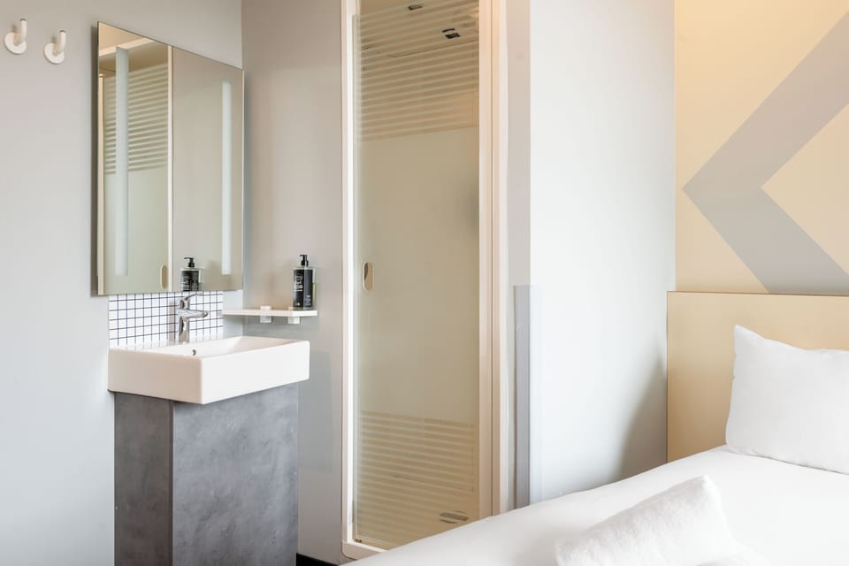 Shower, eco-friendly toiletries, hair dryer, towels