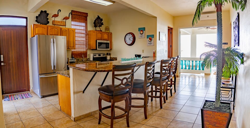 Panoramic Villa, 5 Bedrooms, Hot Tub, Oceanfront | Private kitchen | Highchair, dining tables