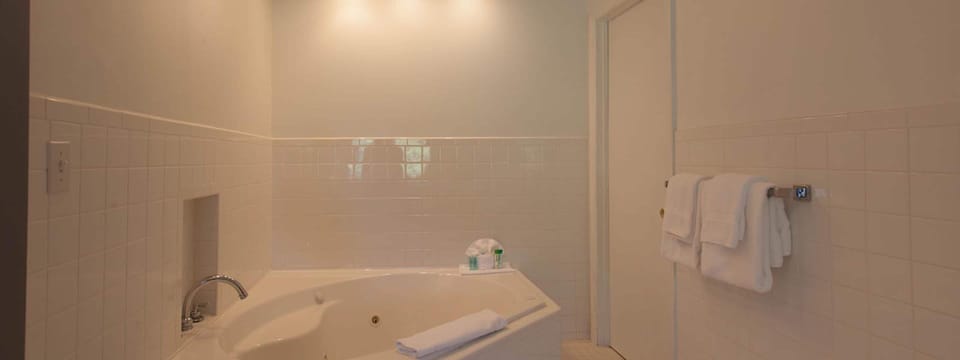 Honeymoon Room, Jetted Tub | Bathroom | Combined shower/tub, hair dryer, towels