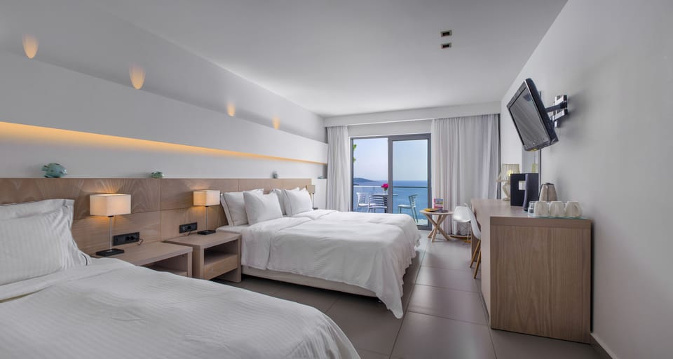 Sea View Triple Room Elevated Ground Floor | Hypo-allergenic bedding, in-room safe, individually decorated, desk