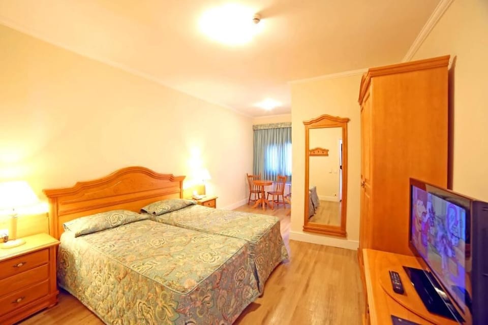 Minibar, desk, blackout drapes, bed sheets