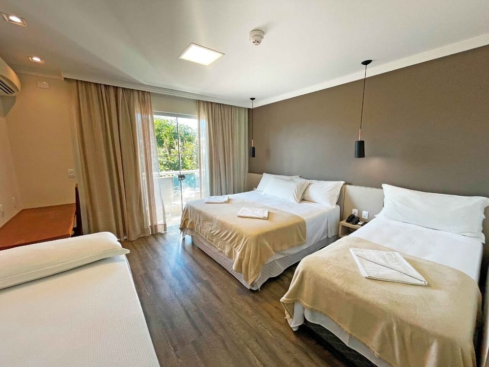 Deluxe Quadruple Room | Premium bedding, minibar, in-room safe, iron/ironing board