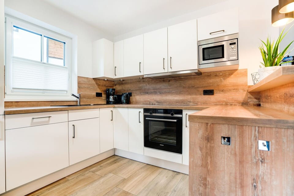 Chalet | Private kitchen | Fridge, highchair